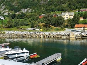 a couple of boats docked at a dock in the water at 6 person holiday home in FISK in Fiskå