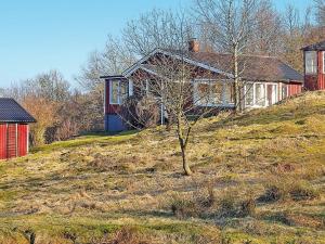 a house sitting on top of a hill at 4 person holiday home in VEBER D in Veberöd