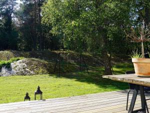 a yard with a swing set in the grass at 7 person holiday home in DJURHAMN in Djurhamn