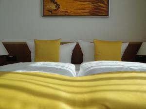 Ein Bett oder Betten in einem Zimmer der Unterkunft Akademiehotel Dresden