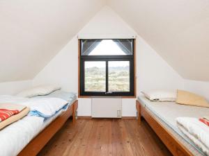 מיטה או מיטות בחדר ב-6 person holiday home in Pandrup