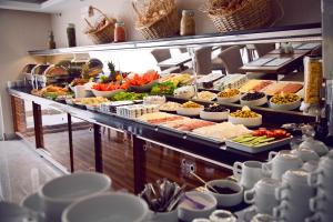 a buffet with a lot of food on display at Esila Hotel in Ankara