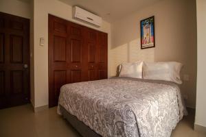 Postel nebo postele na pokoji v ubytování Cartagena Beach Front