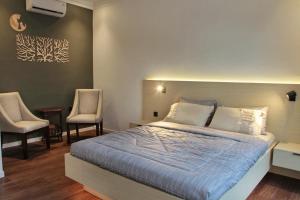 Letto o letti in una camera di villa view2 sayriah