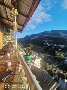 a view of the city from the balcony of a building at 7th Heaven Lodge and Cafe in Banaue