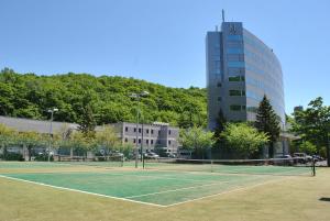 a tennis court in front of a building at Otaru Asari Classe Hotel in Otaru +158 photos
