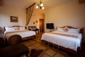 Postel nebo postele na pokoji v ubytování Cloudenjoy B&B