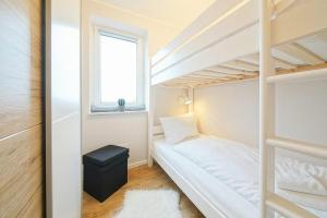 Ein Bett oder Betten in einem Zimmer der Unterkunft Hus Inselkieker Hus Inselkieker 425