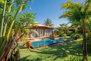 an image of a villa with a swimming pool at Fusion Resort Cam Ranh - All Spa Inclusive in Cam Ranh