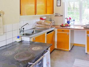 a kitchen with a sink and a stove top oven at 3 person holiday home in Tystberga in Tystberga