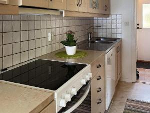a kitchen with a sink and a counter at 4 person holiday home in GISLAVED in Gislaved