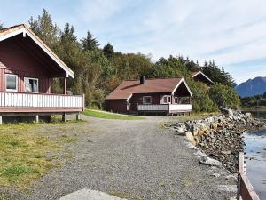 a road leading to two buildings and a house at 6 person holiday home in Bud-By Traum in Bud