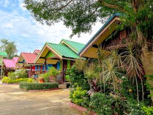 a row of houses with colorful roofs at Ruanmai Style Resort 1 in Ban Nong Nam Khan