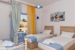 Posteľ alebo postele v izbe v ubytovaní Crystal Villa II
