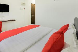 Katil atau katil-katil dalam bilik di Super OYO 89495 Rich Hotel