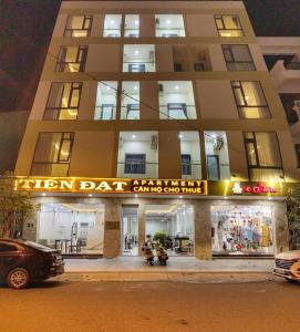 a building with a sign that reads golden bat bakery at Tiến Đạt Apartment in Nha Trang