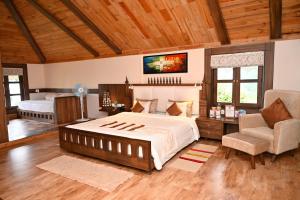 Postel nebo postele na pokoji v ubytování Chamong Chiabari Mountain Retreat