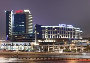 
a city street at night with tall buildings at Lotte Hotel Moscow - The Leading Hotels of the World in Moscow
