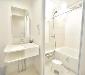 a white bathroom with a sink and a toilet at Fuchsia - Vacation STAY 28744v in Nagoya