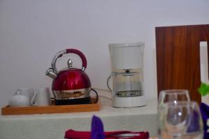 a coffee maker and a blender on a counter at Hotel Barbara Villa in Kalutara
