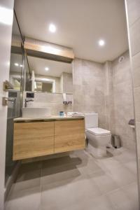 a bathroom with a sink and a toilet at Baron Boutique Hotel Yerevan in Yerevan