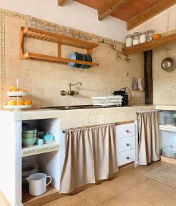 a kitchen with a sink and a counter top at Kleine Finca mit privatem Pool und Klima, ruhige Lage in Algaida
