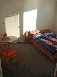 Postel nebo postele na pokoji v ubytování Penzion Koupaliště