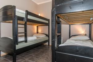 two sets of bunk beds in a room at Trysilfjell Apartment Hotel in Trysil