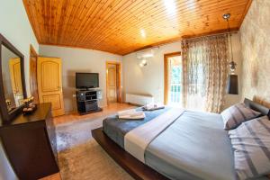 En eller flere senge i et værelse på Vintage Villa