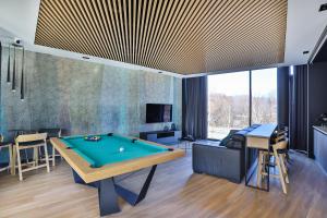 a living room with a pool table at Luxury Tarasy Bałtyku with Stunning Views & Sauna & Gym by Renters Prestige in Gdańsk