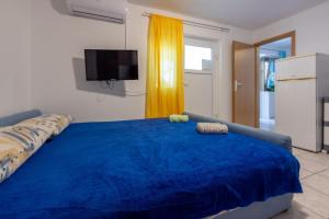 Postel nebo postele na pokoji v ubytování Apartmani Azur