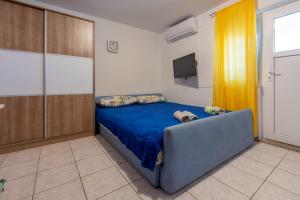 Postel nebo postele na pokoji v ubytování Apartmani Azur