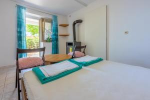 Postel nebo postele na pokoji v ubytování Apartmani Azur
