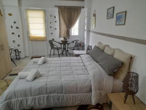 Posteľ alebo postele v izbe v ubytovaní Ifigenia Apartments