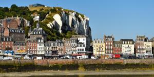 a group of buildings next to a body of water at Agréable maison de ville avec wifi tout à portée de main in Le Tréport