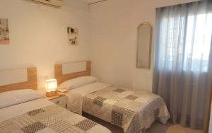Posteľ alebo postele v izbe v ubytovaní Apartamento Talima 6 PAX