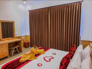 Letto o letti in una camera di Pulu Sari Suite Ubud