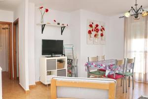 TV a/nebo společenská místnost v ubytování Apartamento Jacinto