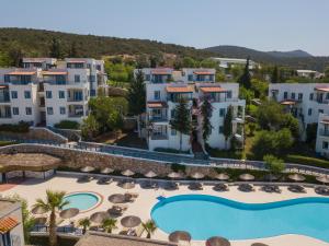 an aerial view of a resort with a swimming pool at Bodrum Holiday Resort & Spa in Bodrum City