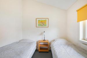 Postel nebo postele na pokoji v ubytování Hello Zeeland - Appartement Beatrixstraat 27