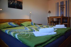 A bed or beds in a room at Hotel Haus am Meer