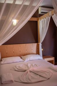 Postel nebo postele na pokoji v ubytování Hotel Epidami
