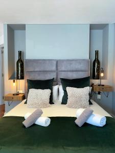 a bedroom with a large bed with three pillows on it at Stay U-nique Apartments Passeig de Gracia II in Barcelona