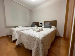 A bed or beds in a room at OKTHEWAY Castelao Street