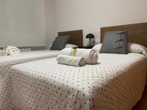 A bed or beds in a room at OKTHEWAY Castelao Street