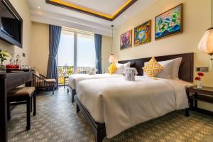 Hoi An Merrily De Art Hotel客房内的一张或多张床位