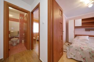 Posteľ alebo postele v izbe v ubytovaní Apartment Simeone