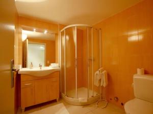 a bathroom with a shower and a sink at Depandance Garni Golf in Ascona