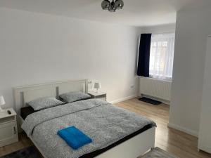 Łóżko lub łóżka w pokoju w obiekcie Center House
