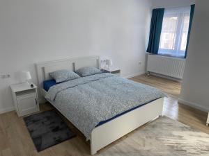 Łóżko lub łóżka w pokoju w obiekcie Center House